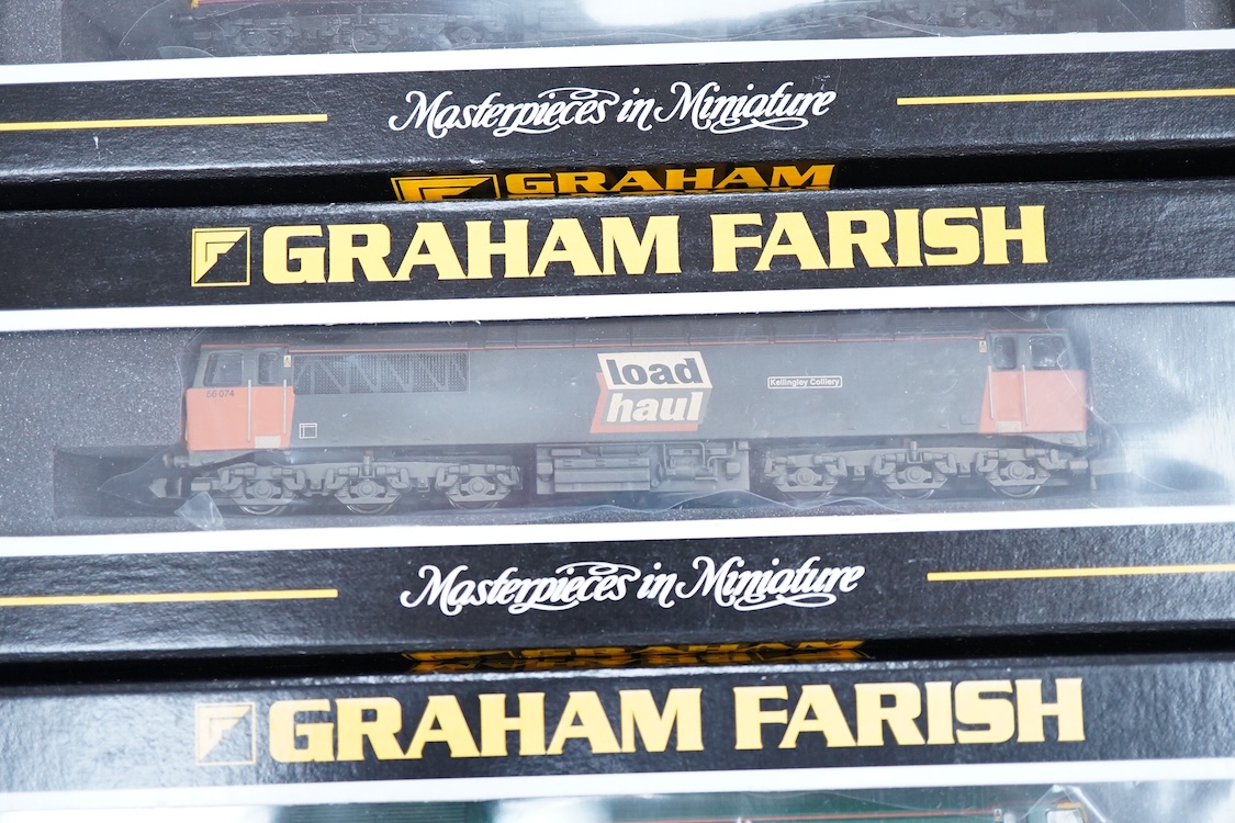 Three boxed Graham Farish N gauge railway diesel locomotives; an EWS class 56, 56105 (371300), a Load Haul class 56, Kellingley Colliery 56 074 (371301), and a Freightliner class 57, Freightliner Challenger 57011, (37122